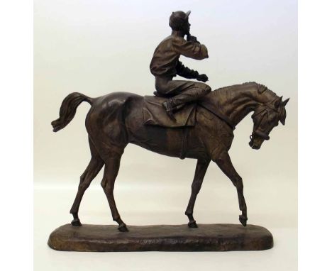 Bronze Figure of a Jockey on Horse back A condition report is not available for this lot.  Damage, defects, restoration or ot
