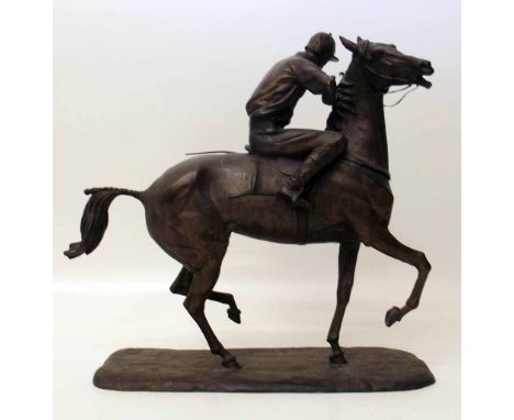 Bronze figure jockey on horse back A condition report is not available for this lot.  Damage, defects, restoration or other f