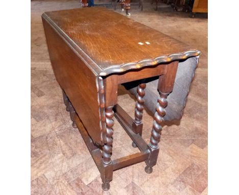 Oak barley-twist gate-leg table. A condition report is not available for this lot.  Damage, defects, restoration or other fau