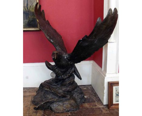 Patinated bronze model of an eagle. A condition report is not available for this lot.  Damage, defects, restoration or other 