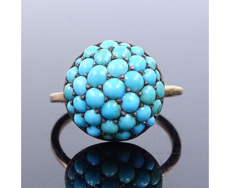 An unmarked gold cabochon turquoise bombe panel ring, Continental silver-gilt backing, panel diameter 14.8mm, panel depth 8.2