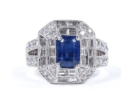 A 14ct white gold sapphire and diamond cluster dress ring, with baguette and round-cut diamonds, and openwork under bridge, s