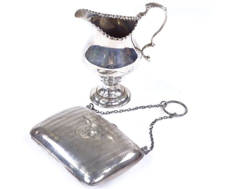 A silver-mounted evening purse, by Boots Pure Drug Company, hallmarks Birmingham 1918, length 10cm, together with an Edwardia