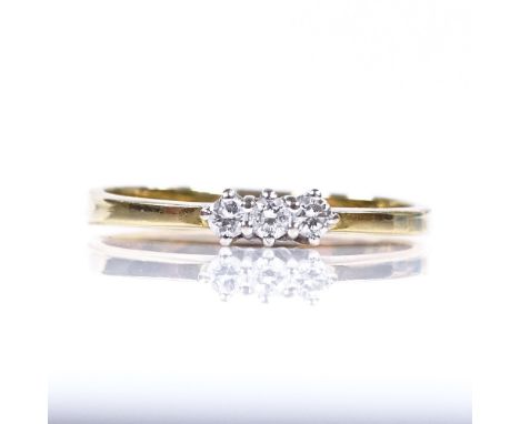 An 18ct gold 3-stone diamond ring, total diamond content approx 0.1ct, setting height 2.9mm, size M, 1.9g 