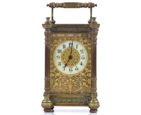 An ornate French brass-cased carriage clock with fretwork decoration, height 13cm 