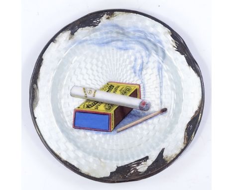 A sterling silver and enamel ashtray, with cigarette and matchbox design, diameter 8.5cm, 1.7oz (some enamel A/F) 