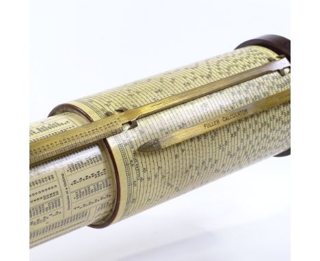 A Stanley Fuller slide rule calculator, showing scales of sines and logs, bakelite and brass case, length 43cm, original wood