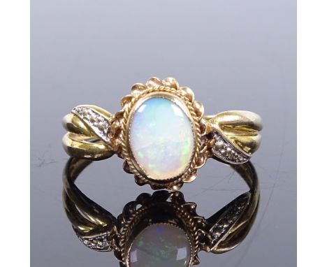 An 8ct gold opal panel ring, with rope twist surround, setting height 12.2mm, size S, 1.9g 