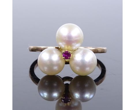 An unmarked gold pearl trio and ruby ring, setting height 12mm, size K, 2.9g 