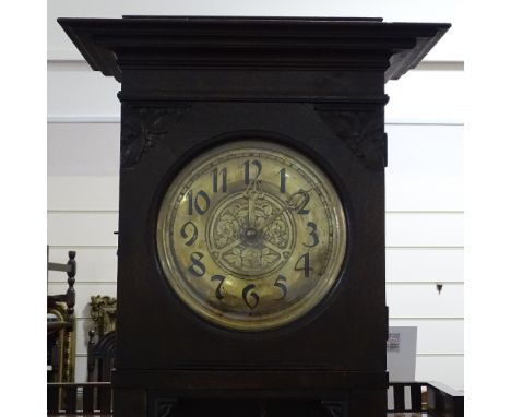 A Scottish Arts and Crafts period carved oak longcase clock, with brass dial and original brass covered weights, height 2m 20