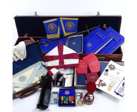 A large collection of Masonic regalia, including several silver and enamel jewels, gold braid ceremonial regalia, Gould's His