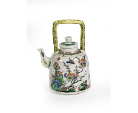 A Chinese Porcelain Kettle and Cover, Kangxi, of bell shape with overhead handle, painted in famille verte enamels with panel