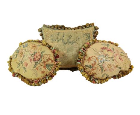A Pair of Tapestry Cushions, in 18th century style, of oval form, worked with flowersprays within tasselled borders, 38cm by 
