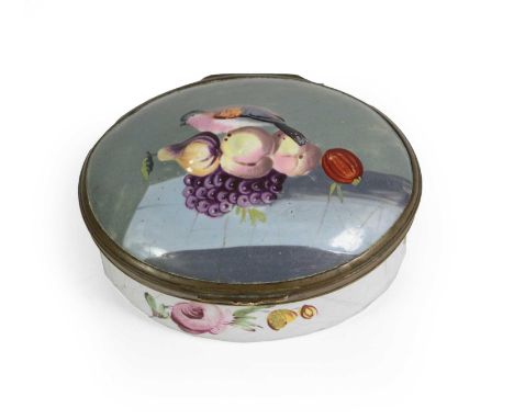 A South Staffordshire Enamel Snuff Box, circa 1770, of oval form, the central lozenge panel painted with a flowerhead and set