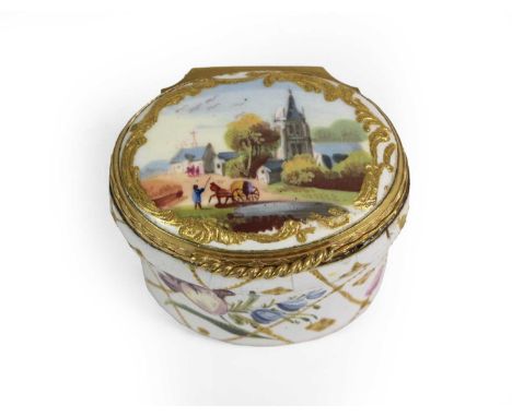 A South Staffordshire Enamel Snuff Box, circa 1765, of oval form, painted with a village scene and with flowersprays on a gil
