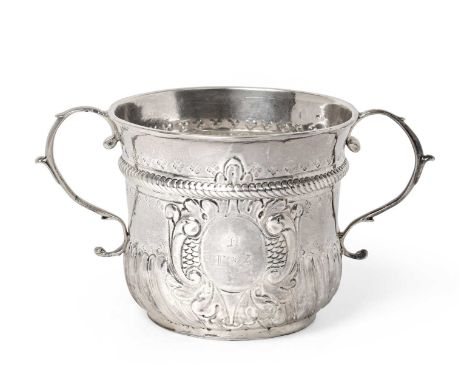 A George I Silver Porringer, by Timothy Ley, London, 1717, cylindrical and with two scroll handles, the lower body with spira