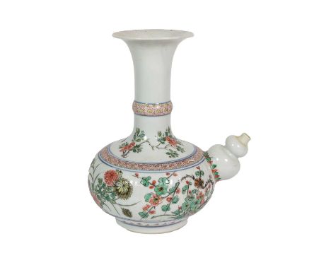 A Chinese Porcelain Kendi, Kangxi, of traditional form, painted in famille verte enamels with bands of flowering peony, lotus