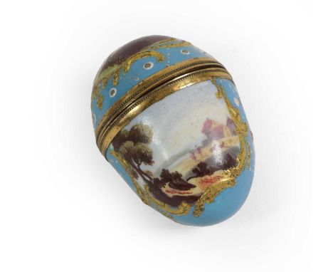 A South Staffordshire Enamel Nutmeg Grater, circa 1770, of egg form, painted with landscapes in panels on a blue ground with 