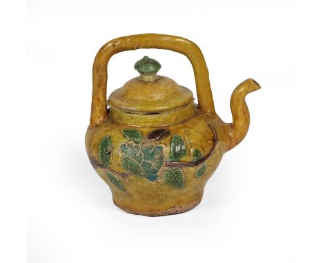 A Chinese Porcelain Ewer, Kangxi, of fluted hexagonal form with scroll spout, painted in famille verte enamels with panels of