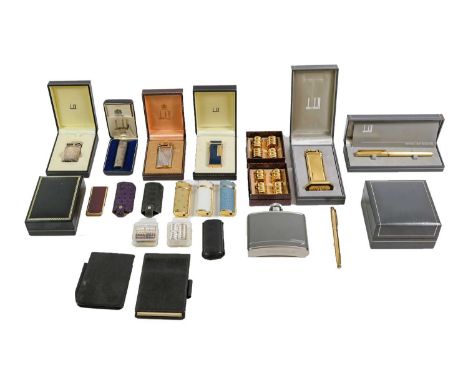 A Collection of Assorted Dunhill Items, including: various lighters; pens and other items; Together With: a copy of Alfred Du