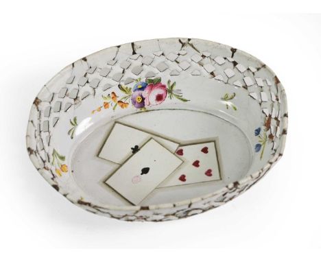 A South Staffordshire Enamel Counter Tray, circa 1770, of oval form, painted with playing cards within a pierced border paint