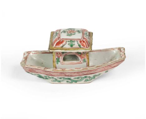 A Chinese Porcelain Model of a Boat, Kangxi, of shaped rectangular form with central cabin, painted in famille verte enamels 