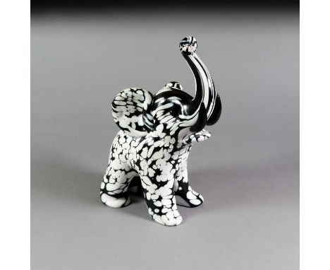 A Murano Bianco Nero Glass Elephant, by Archimede Seguso, stood with raised trunk, signed on front right foot Archimede Segus