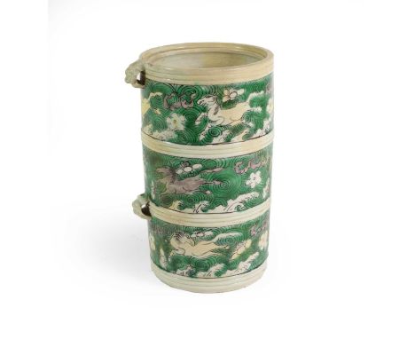 A Chinese Porcelain Cylindrical Box, Kangxi, with mask handles, painted in famille verte enamels with three bands of horses w