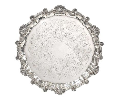 A Spanish Silver Salver, Maker's Mark Indistinct, 20th Century, shaped circular and on four ball and claw feet, with shell an