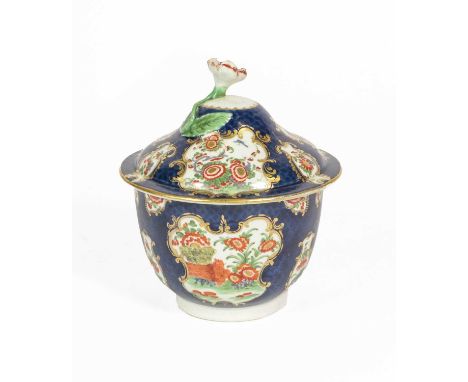 A Worcester Porcelain Sucrier and Cover, circa 1775, painted in kakiemon style with the Rich Queens pattern in panels on a bl