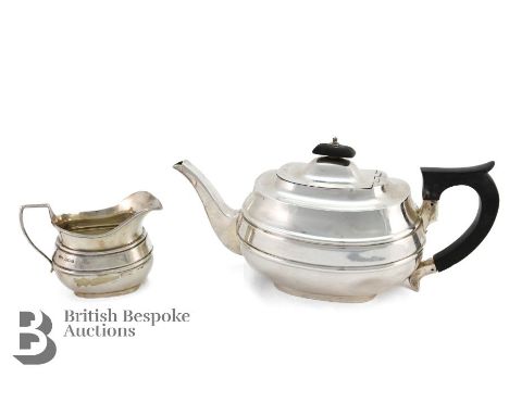 George VI silver tea pot, Sheffield hallmark, dated 1936, mm Emile Viner, approx 648 gms. The teapot having an ebony handle a