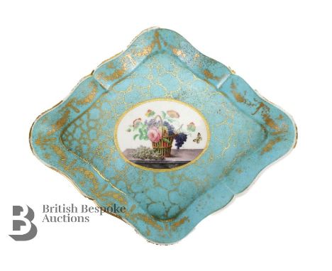 A Sevres turquoise rhombus-shaped cabinet plate, circa 1763,. The plate having a marbled effect turquoise ground with a finel
