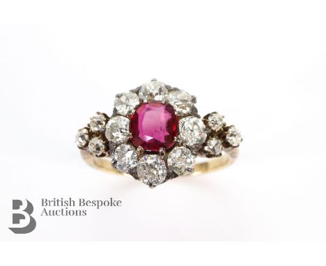 Victorian ruby and diamond ring. The ring set with a single pigeon blood ruby approx 6.1 x 5.7 mm surrounded by 1.12 cts of o