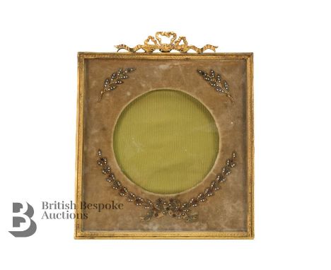 French ormolu picture frame, 19th century, velvet lined mount with seed pearl laurel-leaf decoration, with a gilded ribbon cr