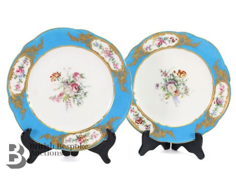 Two French Sevres cabinet plates, both having bleu celeste border with finely painted floral reserves, the verso bearing the 