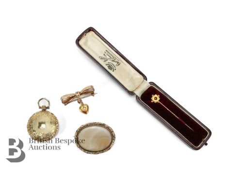 14ct gold ruby and pearl tie pin, approx 1.65 gms in the original red presentation box together with a 9ct gold bow bar brooc