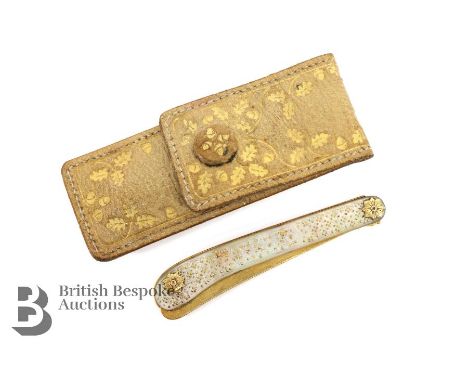 Georgian 18ct gold folding knife, with mother of pearl handle heightened with gold approx 14 cms open. The folding knife hous