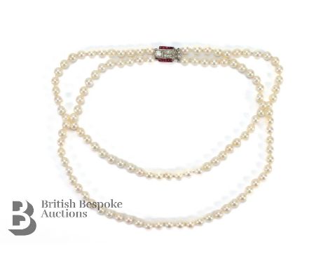Antique double strand pearl necklace, on an Art Deco ruby and diamond clasp. The pearls measures approx 6mm having good lustr