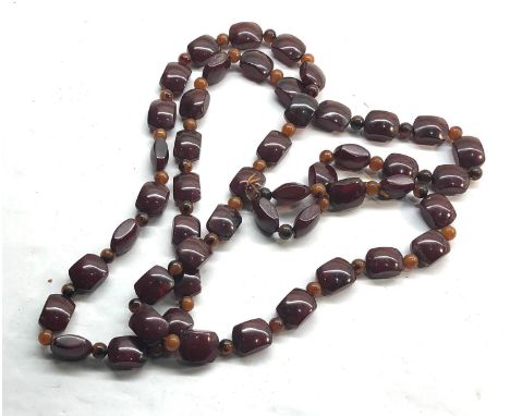 Vintage Cherry amber bakelite type bead necklace shaped beads with small beads in-between measures approx 130cm long weight 1