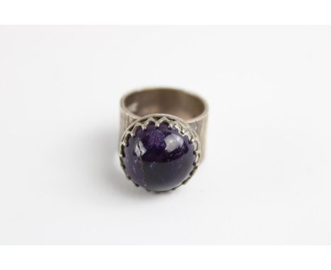 Mid century modernist sterling silver ring set with a larch sugarloaf cut amethyst 