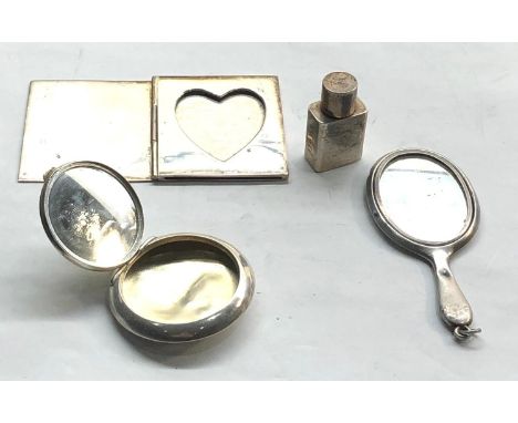 Selection of miniature silver vanity items picture frame , mirror scent bottle and compact 