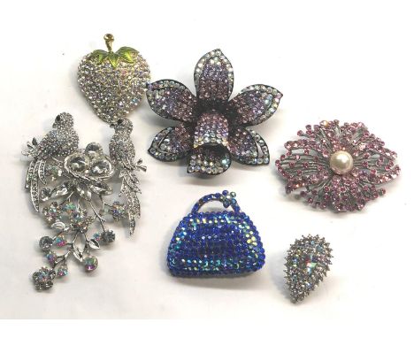 5 Butler and Wilson brooches and 1 ring  all with tags 