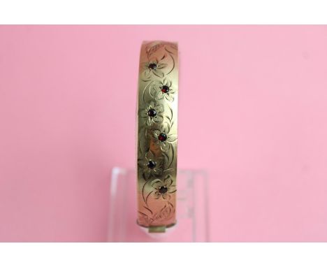 9ct Metal core garnet bangle with engraved floral detailing 