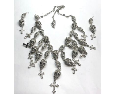 Butler and Wilson Skull necklace and earrings complete with tags 