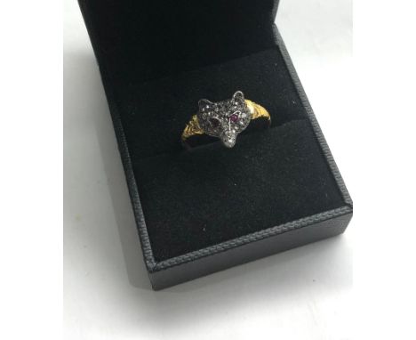 Fox head ring set with rose diamonds and ruby eyes set in gold and silver front, ring size approx Q/R