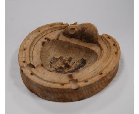 Robert 'Mouseman' Thompson of Kilburn&nbsp;(1876 - 1955) Oak ashtray modelled as a horseshoe with raised border and carved mo