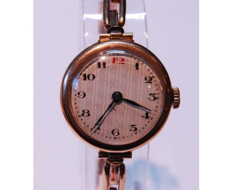 Vintage lady's manual wind 9ct gold wristwatch, the dial with Arabic numerals, on 9ct gold expanding bracelet, 17.8g gross.CO