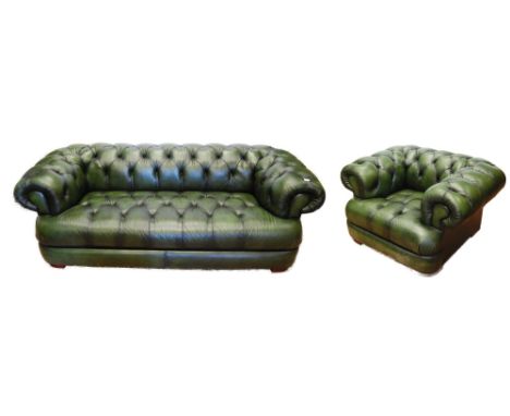 Chesterfield club-style green three-seater sofa and a matching armchair, sofa approximately 60cm high, 215cm wide and 85cm de