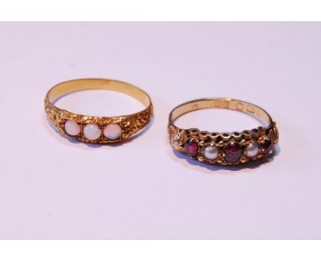 Victorian garnet and pearl ring in 18ct gold, c. 1870, and another with three opals, probably 18ct, 3.6g gross.  (2)CONDITION