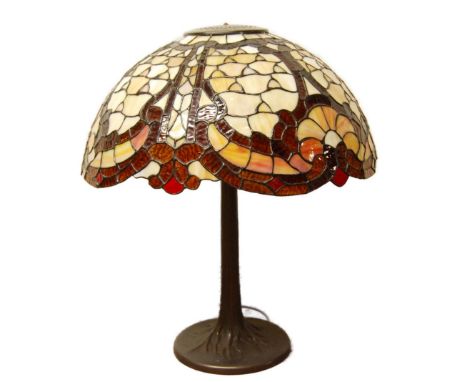Good quality Tiffany of New York-style table lamp with large multi-coloured stained leaded shade, on bronzed column stand and